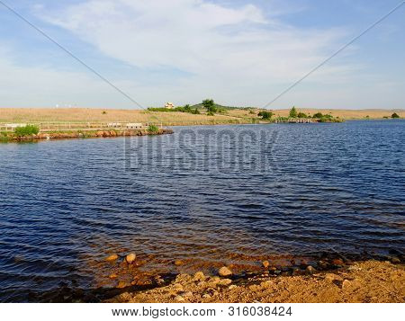 Medium Wide Shot Of Lake Elmer Thomas Early In The Afternoon At Wichita Mountains, Oklahoma