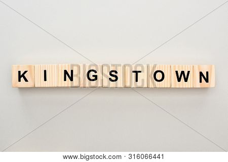 Top View Of Wooden Blocks With Kingstown Lettering On Grey Background