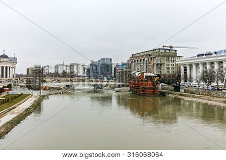 Skopje, Republic Of Macedonia - February 24, 2018: Vardar River Passing Through City Of Skopje Cente