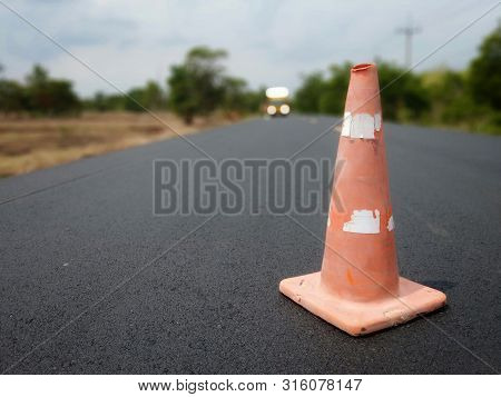 Red Rubber Cone Placed On The Road To Ensure Safety