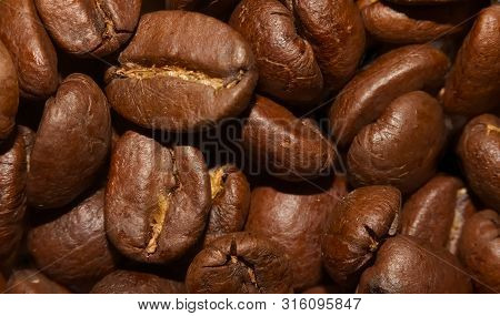 Macro Of Pile Of Brown Coffee Beans