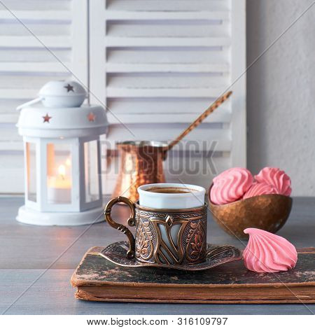 Oriental Coffee Cooked In Traditional Turkish Copper Coffee Pot And  Served In A Matching Cup In Orn