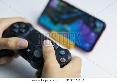 Bishkek, Kyrgyzstan - June 06, 2019: Man Playing Games On Apple Arcade Subscription System On Ios 13