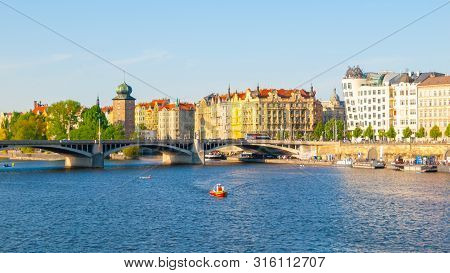 Masaryk Embankment With And Sitkovska Water Tower Palacky Bridge Over Vltava River In Prague City Ce