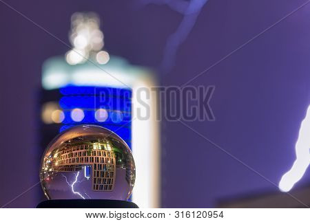 A Lightning Catched In A Lensball At Night.