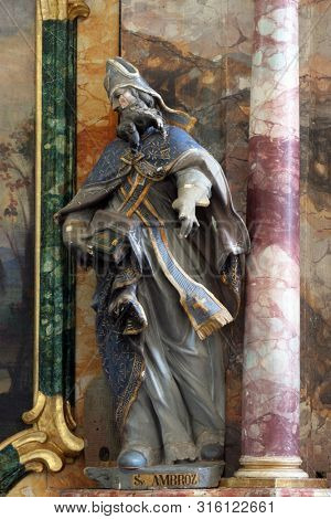 KLOSTAR IVANIC, CROATIA - SEPTEMBER 25, 2011: Saint Ambrose, statue on the altar of the Saint George in the Church of the Assumption of the Virgin Mary in Klostar Ivanic, Croatia