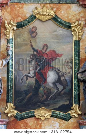 KLOSTAR IVANIC, CROATIA - SEPTEMBER 25, 2011: Saint George slaying the dragon, altar of the Saint George in the Church of the Assumption of the Virgin Mary in Klostar Ivanic, Croatia