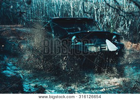 Scene Of Mud Splash In Off-road Racing. Dirty Off Road Trip. Dirty Full Of Mud Suv Type Car Right Af