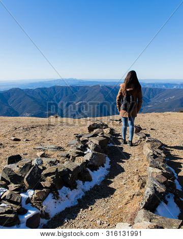 Beautiful Woman Hiking On Mountain Path During Winter Or Autumn In Catalonia (turo Del Home - Spain)