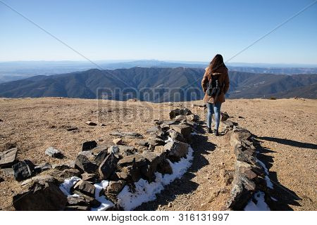 Beautiful Woman Hiking On Mountain Path During Winter Or Autumn In Catalonia (turo Del Home - Spain)