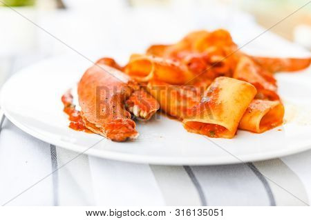 Pasta With Spiny Lobster And Tomato Sauce. Seafood Lunch At The Restaurant And A Glass Of White Wine