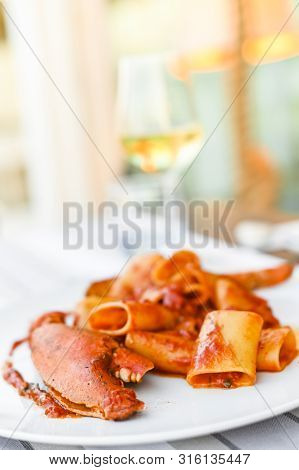 Pasta With Spiny Lobster And Tomato Sauce. Seafood Lunch At The Restaurant And A Glass Of White Wine