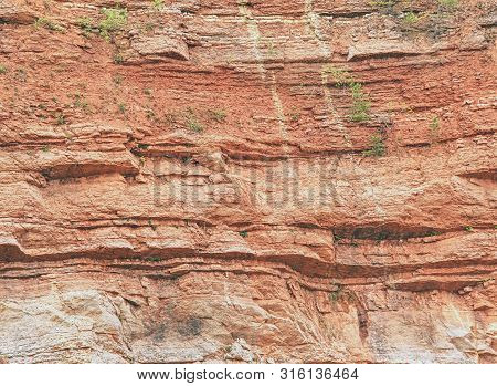 Ancient Multi-layered Lime And Feric Lines In Wall Surface Of Mine Rocks