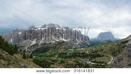 Panoramic View Of The Sella Group, Gardena Pass And Sassolungo Mountain From Pizes De Cir. Dolomites