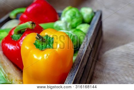 Various Non-toxic Fresh Vegetables Are Placed In A Wooden Box Placed On A Mat. Many Vegetables Are P