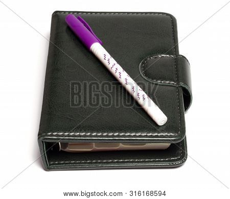 Diary And Hand Lie On A White Background