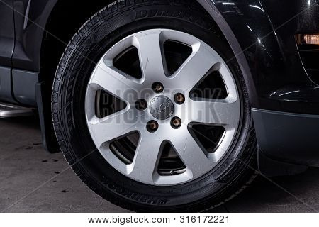 Novosibirsk, Russia - July 30, 2019: Audi Q7, Close-up Of The Alloy Wheel. Photography Of A Modern C