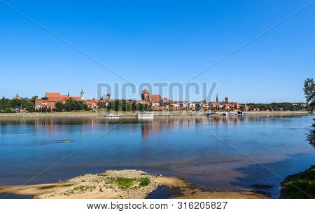 Panoramic View Of Torun City And Wisla (vistula) River In Sunny Day. Poland, Summer 2019