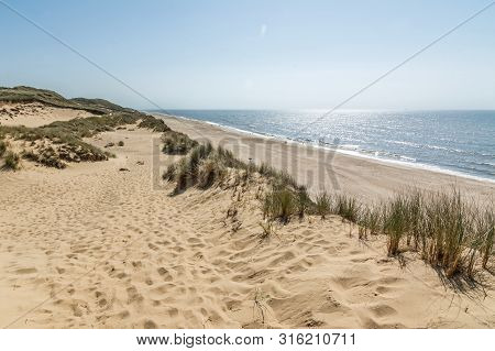 Hiking Trail In Beautiful Dune Landscape With Beach And Ocean In The Background On The Island Of Syl