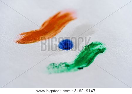 Close-up Shot Of Hand Painting Of Indian Flag On A White Background.