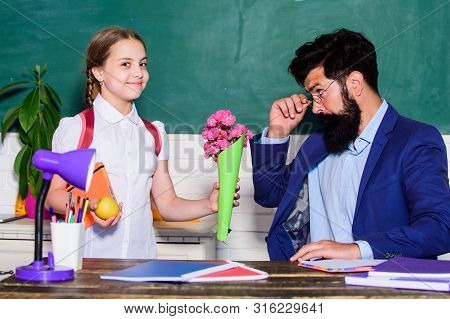 Gift. Small School Girl Kid With Flower Bouquet. Teachers Day. Daugghter And Father With Flowers. Fl