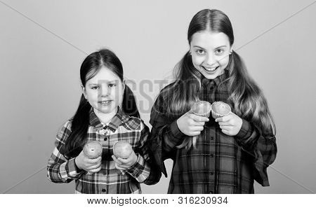 Muffin Fight. Small Children Happy Smiling With Quickbread Muffins. Happy Little Girls Baking Breakf