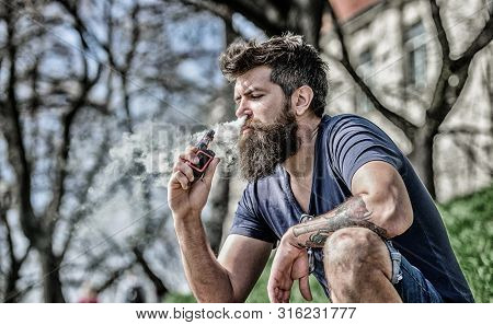 Man With Beard Breathe Out Smoke. Clouds Of Flavored Smoke. Stress Relief Concept. Bearded Man Smoki