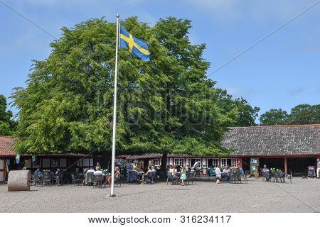 Krapperup, Sweden - 29 June 2019: People Drinking On A Restaurant At Krapperup On Sweden