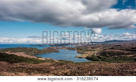 View Over Ardvar, Loch Ardbhair And Islands Out To Sea On The North Coast Of Scotland