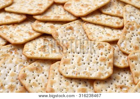 Tuc Original Snack Crackers Lies On Market Table Stacked In Big Pile
