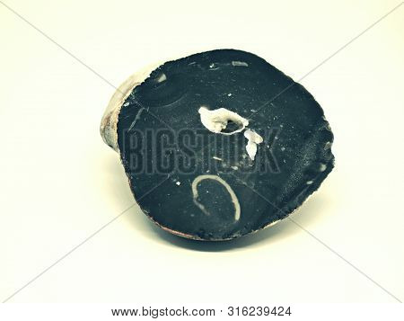Chipped Obsidian Stone With Cavity Inside, Sharp Cracks Flint. Isolated Stone On White