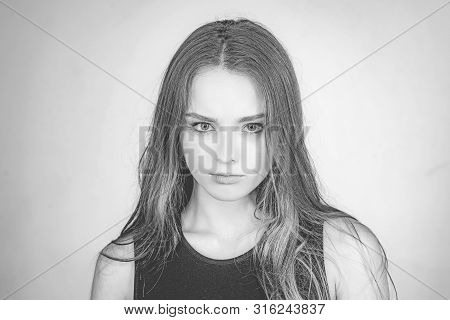 Fashion Portrait Of A Beautiful Young Woman Posing Over White Background. Close Up Portrait Of A Bea