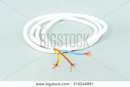 Three-core Cable In White Isolation On A Gray Background