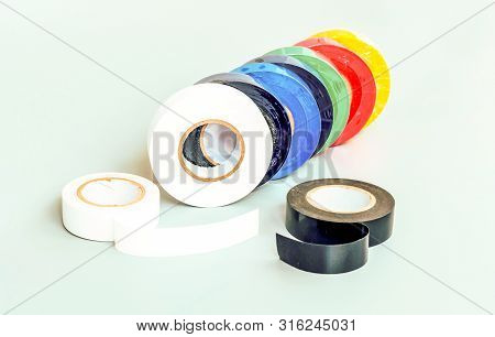 Set Of Multicolored Insulating Tapes On Gray Background