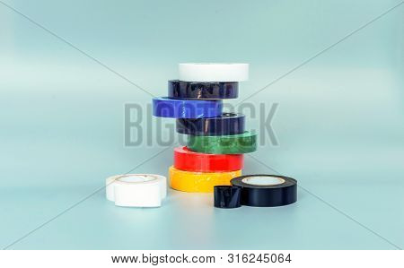 Set Of Multicolored Insulating Tapes On Gray Background