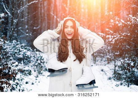 Christmas Winter Girl Outdoor Portrait. Young Woman Winter Portrait. Snowing Winter Beauty Fashion C