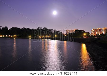 Moon Light With Its Reflection On Macritchie Reservoir (singapore) By Night