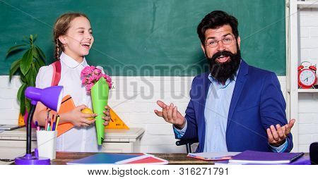 Flower Present For Best Teacher. Teachers Day. Daugghter And Father With Flowers. Small School Girl 