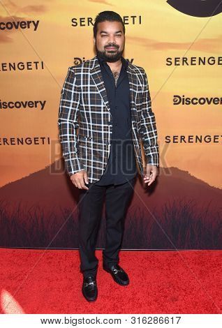 LOS ANGELES - JUL 23:  Adrian Dev arrives for the 'Serengeti' Special Screening on July 23, 2019 in Beverly Hills, CA                