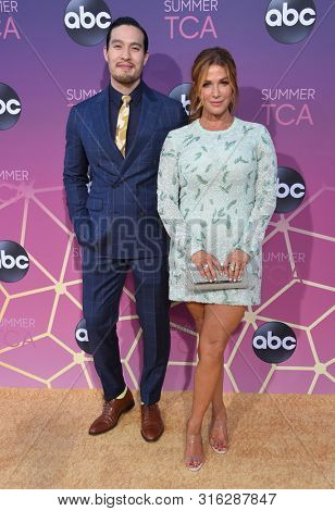 LOS ANGELES - AUG 05:  Desmond Chiam and Poppy Montgomery arrives for the ABC's Summer TCA All Star Party on August 05, 2019 in West Hollywood, CA                
