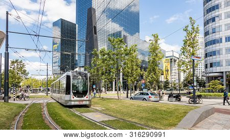 Tram In The Rotterdam City Center, Office Buildings Background