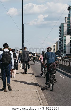 London, Uk - July 16, 2019: Pedestrian And Cyclists On Vauxhall Bridge In London, During Rush Hour, 