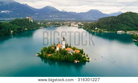 Bled, Slovenia. Aerial Drone View Of Lake Bled With The Pilgrimage Church Of The Assumption Of Maria