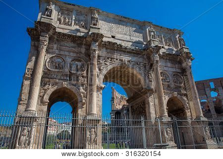 Rome, Italy - April, 2018: The Arch Of Constantine A Triumphal Arch In Rome, Situated Between The Co