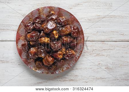 Delicious Organic Sweet Dates In Bowl With Syrup. Iftar Dates.