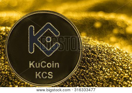 Coin Cryptocurrency Kucoin Kcs And Gold Fabric Background.