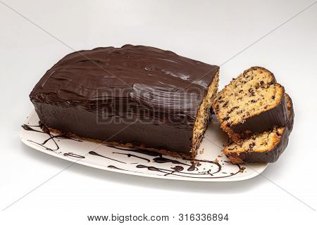 Sponge Cake, Pot Cake Or Also Called Box Cake With Chocolate Sauce, Sliced.