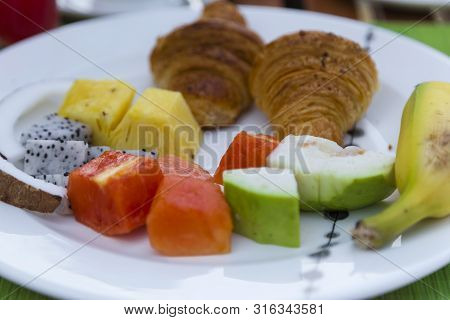 Breakfast With Tropical Fresh Fruit And Pancakes