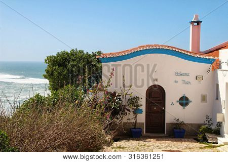 Azenhas Do Mar, Sintra, Lisbon, Portugal- March 19, 2019: Beautiful Narrow Streets, White Houses And