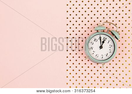 Flat Lay With Vintage Alarm Clock Over The Bastel Background